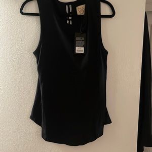 Black tank with open tie back. New with tags!
